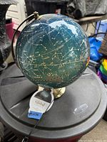 LED constellation globe showing star patterns and zodiac signs with switch and cord visible