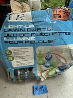 Damaged and wet original box showing product branding and features.