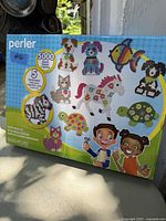 Box cover showing multiple animal bead designs, 5000 beads, 5 pegboards.