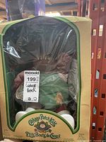 Front view of boxed doll showing packaging and doll details