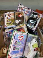 Photo showing several TY Teenie Beanie Babies including Steg and Chilly in original McDonald's packaging.