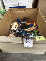 Box containing assorted action figures