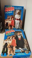 Photo showing both Annie dolls Daddy Warbucks and Punjab in original packaging with 1982 copyright.