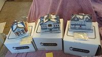 All three porcelain village buildings on original Hawthorne Village boxes, certificates visible