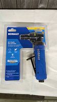 Front view of sealed Kobalt 1/4-in air angle die grinder package