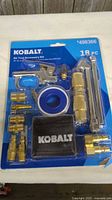 Front of sealed Kobalt SGY-AIR200 18-piece air tool kit in blister pack