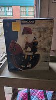 Front of boxed Kirkland Signature wooden rocking horse nutcracker
