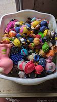 Large white tub filled with assorted squishy toys