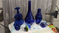 all six cobalt blue glass pieces displayed