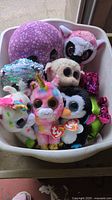 All eight Ty Beanie Boos grouped in tub