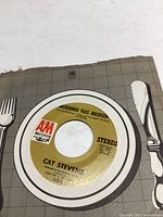 Photo of 45 RPM vinyl single 'Morning Has Broken' by Cat Stevens with original A&M Records sleeve showing some edge wear.