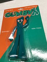 Front of unopened Gumby figure showing green character on bright card
