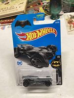 Image showing unopened Hot Wheels 2015 Batmobile die-cast car in original packaging with branding and logos.