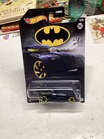 Photo of unopened Hot Wheels 2020 Batmobile die-cast car on original packaging featuring Batman logo and DC Comics branding.