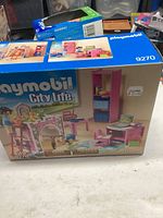 Front of the Playmobil City Life 9270 box showing assembled bedroom furniture and figures