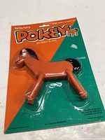 Front of unopened Pokey bendable figure on colored card