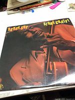Front cover of Buddy Guy Stone Crazy vinyl LP record album showing Buddy Guy playing guitar in a brown jacket.