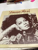 Front cover of the Diana Ross Greatest Hits vinyl record album featuring a black-and-white photo of Diana Ross.