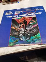 Front cover showing blue background with illustrated artwork of James Bond action scene.