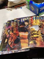 Six Hellblazer comics in protective sleeves laid out showing cover art and spines, confirming quantity and condition