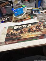 Photo of closed game box showing vintage battle artwork and brand name MB Stratego.