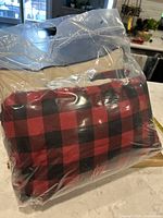 Mountain plaid red and black duvet cover and shams packaged in clear plastic bag