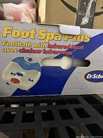 Box of Dr. Scholl's Foot Spa Plus showing product name, features, and brand.