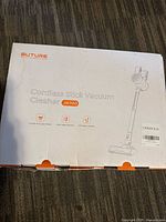 Box of Buture JR700 cordless stick vacuum cleaner showing brand, model and features.