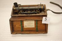 Surveyors' level and oak case with manufacturer label inside lid