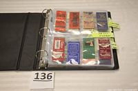 Photo of binder page with 12 vintage matchbook covers featuring local businesses and hotels from towns like Paoli and Chester Springs.