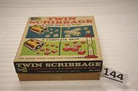 Front view of the Twin Scribbage board game box showing the colorful artwork and game info