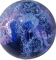 Close-up front angle of the Caithness Highseas paperweight showing blue and purple swirling bubble design with reflections and signature marks.