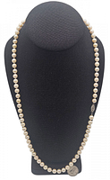 Full view of necklace displayed on black bust showing overall length and pearl uniformity