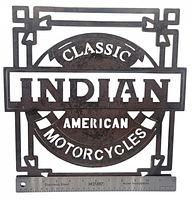 Front view of the metal Indian Motorcycles sign showing the detailed text and design with a ruler for scale.