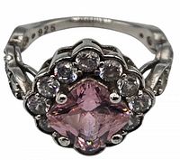 Close-up front view of sterling silver ring with pink cushion-cut stone and clear halo stones
