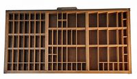 Top view of the first vintage wooden printers tray showing the grid of compartments