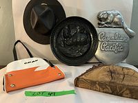 Full lot photo showing Ontario Police hat, CPAir bag, two Beaver plaques, and wooden item