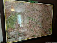 Framed map of Paris showing city layout and black frame.