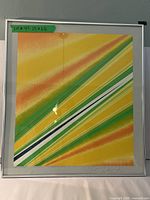 Front view of framed serigraph showing abstract diagonal stripe design and overall composition