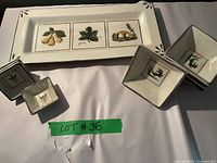 Full view of rustic serving platter and 5 ceramic bowls in a set on white cloth background.