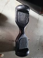 Top view of the black Airwalk hoverboard showing textured footpads and overall physical condition.