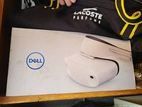 Original white box with Dell logo and headset image on top, showing minor wear and scuffs.