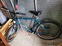 Full side view of the Raleigh Alloy 18 Speed mountain bike showing the frame, tires, seat, and handlebars.