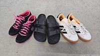 Photo of all three pairs of shoes: Skechers sneakers, Slides sandals, Adidas sneakers