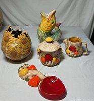 Full view of the set showing sunflower vase, fish pitcher, mushroom sugar bowl and creamer, and mushroom spoon rest