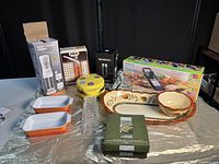 Full assortment showing baking dishes, coffee maker, timers, serving ware and slicer boxed