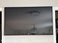 Front view of the LG 52-inch flat screen television with black bezel.