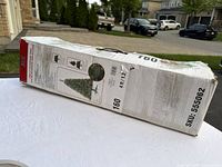 Box of Ashland Pre-lit Riverside Tree showing product features and image of assembled tree with lights.