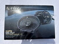 Retail box showing Infinity by Harman Kappa 682.11cf branding and peak power handling info.