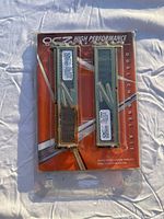 Front photo of OCZ PC2-3200 DDR2 RAM dual channel kit in sealed packaging showing the two memory modules with heat spreaders.